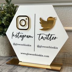 the instagram logo is on top of a white and gold hexagonal stand