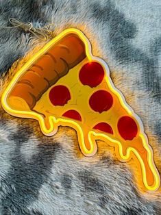 a slice of pizza with cheese and pepperoni on it is glowing in the dark