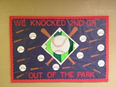 a baseball themed banner hanging on the wall with bats and balls around it that says we knocked 2nd gr out of the park