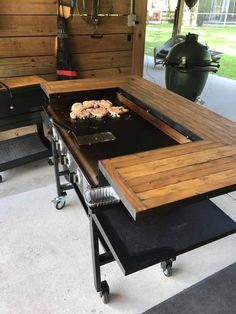 an outdoor grill is set up in the garage