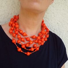 Orange  Necklace Orange color is very popular this year also the shape of the necklace is very attractive, elegant and modern. You can wear a necklace in many different dress styles. The necklace is made of wooden beads because is the necklace very light and comfortable. You can wear a necklace for many years, but be careful and please not to go into the water with it. ---------------------------- If you wish you have a set, you can also have a bracelet and a ring: Bracelets: https://www.etsy.co