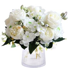 a vase filled with white flowers on top of a table