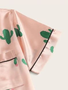 Indulge in relaxation with our Cactus Print Satin Pajama Set. Embrace comfort as you slip into the silky embrace of this 2-piece marvel. Its botanical charm, accentuated by a collar neckline, button details, and pockets, brings a touch of nature to your lounging moments. Crafted for a loose fit and adorned with contrast binding, these short-sleeve pajamas exude casual elegance. Specifications: Pattern Type: Plants Type: Short Sets Neckline: Collar Details: Button, Pocket, Contrast Binding Sleeve Casual Fitted Sleepwear For Home, Satin Short Sleeve, Satin Pyjamas, Birthday Gift For Friend, Satin Pajama Set, Satin Pajama, Satin Shorts, Satin Short, Satin Pyjama Set