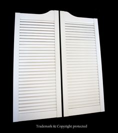 two white shutters are shown against a black background