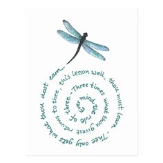 a blue dragonfly sitting on top of a white paper with words written in it