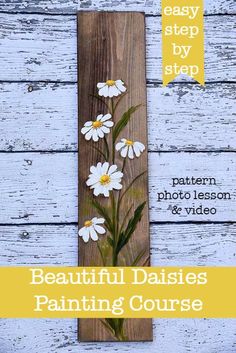 a wooden plank with daisies painted on it and the words, easy step by step