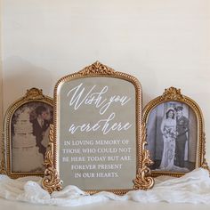 two gold framed pictures sitting on top of a white table next to an old fashioned frame