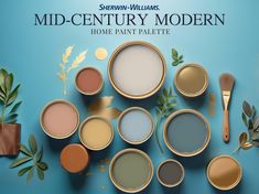 several different shades of paint next to each other on a blue background with text that reads, mid - century modern home paint palette