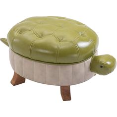 a green turtle ottoman sitting on top of a wooden table