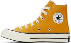 High-top canvas sneaker in yellow. · Lace-up closure · Eyelet vents and leather logo patch at inner side · Canvas lining in off-white · Rubber midsole in off-white and logo patch at heel · Treaded rubber outsole in brown Supplier color: Sunflower Converse Yellow, Chuck 70, Yellow Lace, Converse Sneakers, Mens Sportswear, Leather Logo, Sneaker Collection, Canvas Sneakers, Converse Chuck Taylor High Top Sneaker