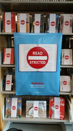 there is a sign that says read restricted on the back of a book shelf in a store