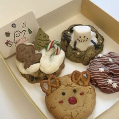 a box filled with different types of cookies