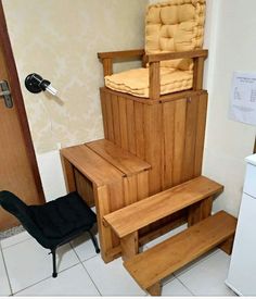 a wooden chair sitting on top of a white tiled floor next to a black chair