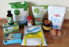 an assortment of ingredients on a table including eggs, flour, butter and seasoning