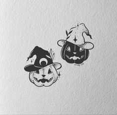 two halloween pumpkins with faces drawn on them, one is wearing a witch hat