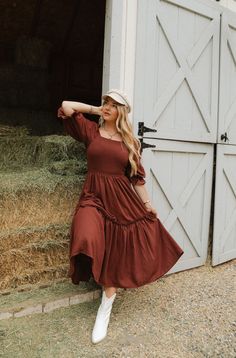 Our best-selling silhouette is back!! The Lani Dress in Brown is a playful and versatile women's dress. Made from soft 100% cotton fabric, she features a square neckline and 3/4 length balloon sleeves with ruffle detailing. The midi-length skirt adds a fun and flirty touch, while the smocked bodice makes it easy to pull on and ultra comfortable - nursing friendly + maternity friendly too! fall aesthetic, pinterset outfit, fall outfit, family photos, country aesthetic, equestrian Thanksgiving Dress, City Woman, Nursing Friendly, Holiday Party Dresses, Midi Length Skirts, Mom Dress, Vacation Dresses, Tier Skirt, Everyday Dresses