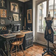 an old fashioned sewing machine sitting on top of a wooden table next to a window