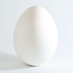 an egg sitting on top of a white table