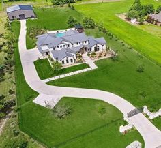 an aerial view of a large home in the country