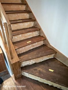 the stairs are made out of wood and have been stripped