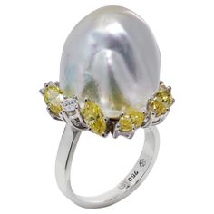 Presenting an exquisite Koch natural South Sea baroque pearl ladies ring crafted in 18kt white gold, adorned with fancy yellow and white diamonds. Ring Details: Ring size: 3.2 x 2.2 x 1.8 cm Finger Size: UK: F EU: 44 US: 3 Weight: 12.00 grams Pearl: Cut: Baroque ,Irregular shape Size: Length: 20 mm Width: 15 mm Diamonds: Cut: Marquise and round brilliant Quantity: 8 Carat Weight: 0.83 carats Colour: E-F, Fancy Yellow Clarity: VS1 Condition: The ring is pre-owned and shows minor signs of usage bu Frankfurt Germany, Jewellery Marketing, Ladies Ring, Diamonds Ring, Ring Crafts, Rare Gemstones, South Seas, Kochi, White Diamonds