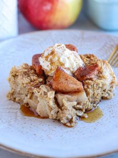 a white plate topped with an apple and oatmeal breakfast casserole