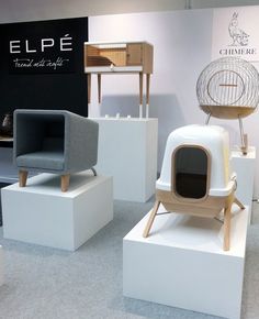 several different types of furniture on display in a room