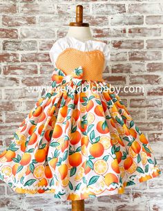 This sweet dress is perfect for your orange themed party or photoshoot! It has a twirling skirt trimmed in ricrac and a reverse knot bodice with the cutest detailing. We typically recommend ordering the size corresponding with age for the best fit. This dress is made to be worn at an above the knee vintage length. Playful Orange Sleeveless Dress, Orange Cotton A-line Dress, Orange A-line Cotton Dress, Orange Cotton Party Dress, Playful Orange Cotton Dress, Playful Orange Dress For Spring, Playful Orange Spring Dress, Sleeveless Orange Dress For Garden Party, Orange Ruffled Dress For Garden Party