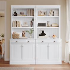 a white bookcase with many books on it