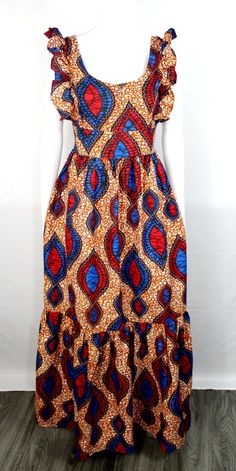 Look stunning in this handmade African print maxi dress with a colorful geometric pattern. The dress features a round neckline, flared sleeveless, and a high waistband, making it perfect for a wedding, holy communion, party, or casual outing. The dress is made of woven polyester and cotton material with ruffle and zipper accents and is machine washable for easy care. This sleeveless dress is available in size M,L,XL, and XXL and is perfect for women who love vibrant and colorful outfits. The dress is ideal for summer, fall, and spring seasons and comes with a zip closure. Make a fashion statement with this unique dress that is handcrafted with love. African Modern Dresses, Chitenge Dresses, Wax Dress, African Print Maxi Dress, Holy Communion Party, African Attire Dresses, Colorful Geometric Pattern, Colorful Outfits, Communion Party