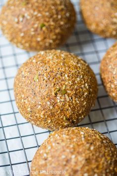 several balls of food sitting on top of a cooling rack