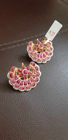 *It is Handmade Indian Ethnic Kundan Earrings with Pink color combination. *It is made from Silver and Copper Pink Stones Settings with 22k gold Plating. *It gives Pure Ethnic Look and is 1.5 inches in size. *Our all jewelry is made from semiprecious stones and beads. *WARRANTY: ITS GENUINE HANDMADE JEWELRY AND WE ARE GIVING LONG LIFE WARRANTY FOR OUR ALL ITEMS. All of our Kundan Jewelry is 100% handmade with ancient Kundan stone setting method using silver foils. It is one of the most favorable Kundan Chandbali, Earrings Kundan, Pink Color Combination, Copper And Pink, Gold Necklace Indian, Kundan Jewelry, Gold Necklace Indian Bridal Jewelry, Fancy Jewellery Designs, South Indian Jewelry