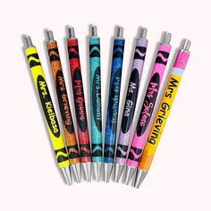 six pens are lined up in a row on top of each other, with different colors