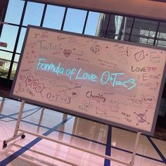 a white board with writing on it in front of a large glass window that reads, formula of love oils