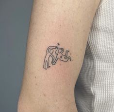 a woman with a small tattoo on her arm