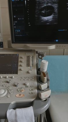 an image of a medical machine in front of a monitor