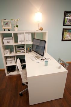 an office desk with a computer on it