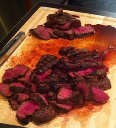 steak on a cutting board being prepared to be cooked