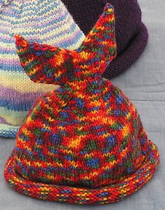 three knitted hats sitting next to each other