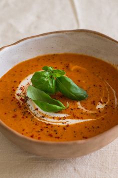 a white bowl filled with soup and garnish