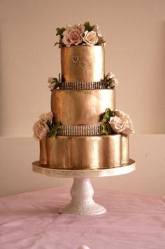 a three tiered wedding cake with flowers on the top is displayed in an instagram