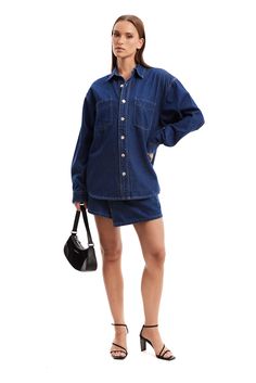 The Sana Shirt Blue by Nakedvice is an oversized denim shirt. Featuring pockets on the front chest and pleat detail at back, The Sana Shirt Blue is the perfect denim shirt. Pair with The Sana Skirt Blue for a complete look. 

Ariarne wears a size S and is 176cm tall. 
 Size: XS, S, M, L, XL, XXL; Colour: BLUE Oversized Denim Shirt, Perfect Denim, Contrast Stitch, Blue Shirt, Fashion Flats, Denim Shirt, Eden, Skirt, How To Wear