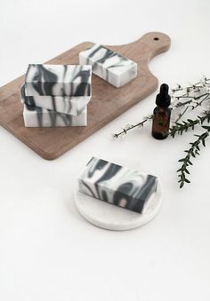 some soaps are sitting on a cutting board