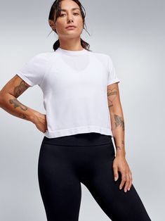 HERE TODAY Cropped Tee White – LNDR US Versatile White Crew Neck Top, Modern Cotton Sports Tops, Casual Short Sleeve Tops In Recycled Polyester, Sporty Short Sleeve Top For Layering, Casual Tops With Moisture-wicking For Layering, Casual Moisture-wicking Tops For Layering, Modern Stretch Tops For Sports, Modern Stretch Sports Top, Relaxed Fit Short Sleeve Tops In Recycled Polyester