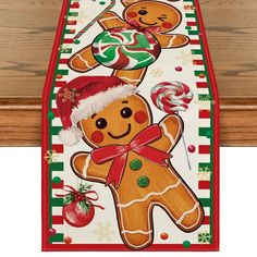 a christmas table runner with gingerbreads and candy