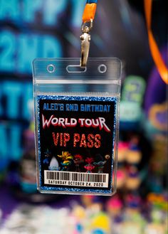 a close up of a tag on a keychain that says world tour via pass