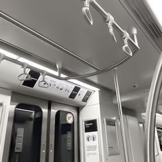 an empty train car with two doors and no people on the inside, in black and white