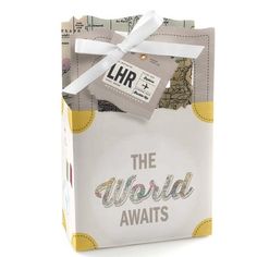 the world awaits gift bag in white with yellow trim and silver foil on it