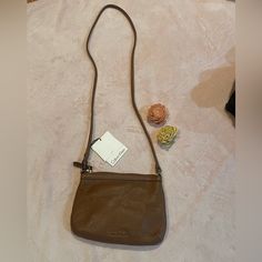 This Small Calvin Klein Crossbody Is So Cute And Brand New!! A Brown Color That Goes Well With Anything. 100% Leather Closure Type - Zipper Lining - Polyester Pockets: 1 Interior Slip, 1 Interior Zip Pebble Leather Crossbody Bag Width 8.5 Inch 6 Inch Height 2.6 Inch Depth 23 Inch Strap Drop Casual Calvin Klein Shoulder Bag, Calvin Klein Bags, Chestnut Leather, Calvin Klein Bag, Vintage Calvin Klein, Zip Purse, Brown Purses, Cross Bag, Black Crossbody