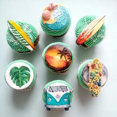 cupcakes decorated with different designs and colors on top of each other, including a vw bus